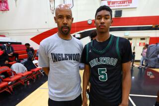 Jason Crowe Jr. (right) and his father. Crowe scored 55 points for Inglewood in an opening game of the Classic at Damien.