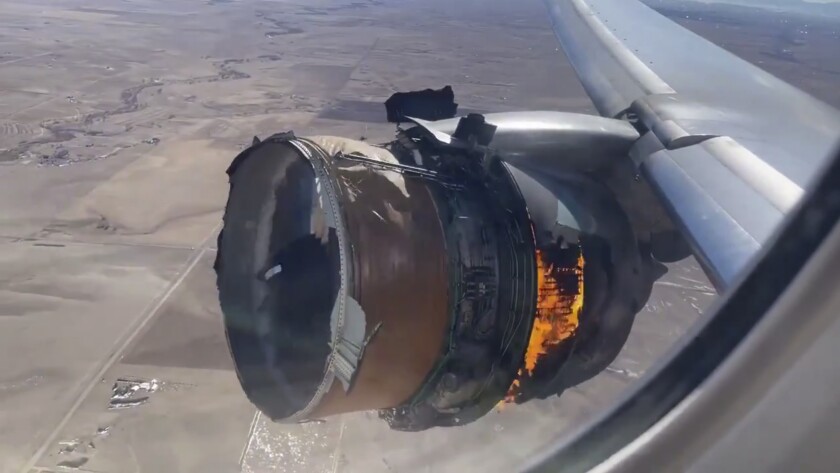 FILE - In this file photo taken from video, the engine of United Airlines Flight 328 is on fire after experiencing "a right-engine failure" shortly after takeoff from Denver International Airport, Saturday, Feb. 20, 2021, in Denver, Colo. Two passengers who were on board the United Airlines airplane that had to make an emergency landing are suing the company in separate suits filed Friday, April 16 in Chicago, where United is based. (Chad Schnell via AP, File)
