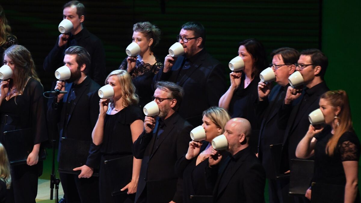 Schola Cantorum Reykjavík sings in teacups for the world premiere of Thuridur Jónsdóttir’s “Cylinder 49,” part of the Los Angeles Philharmonic's Reykjavík Festival concert Tuesday.