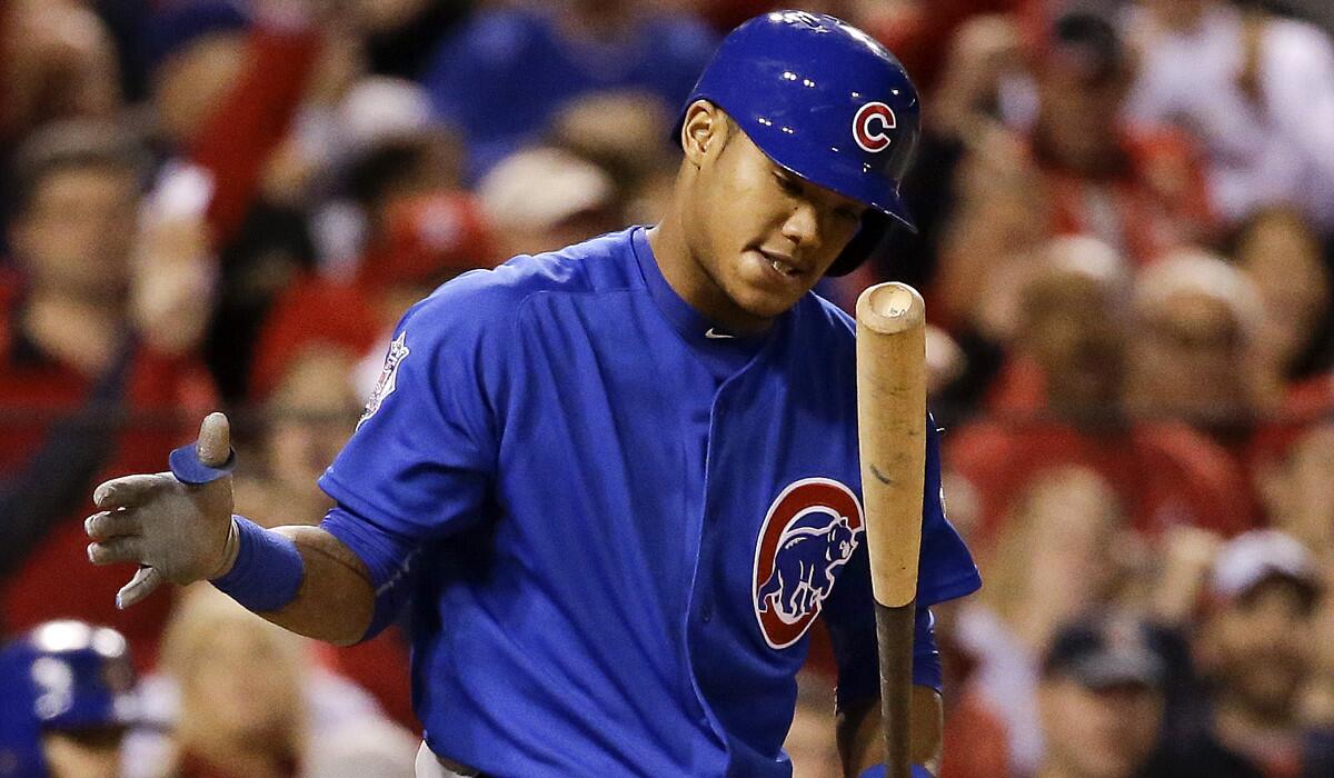 Chicago Cubs' Addison Russell reacts after striking out during the eighth inning of Game 1 of the National League Division Series against the St. Louis Cardinals on Oct. 9.