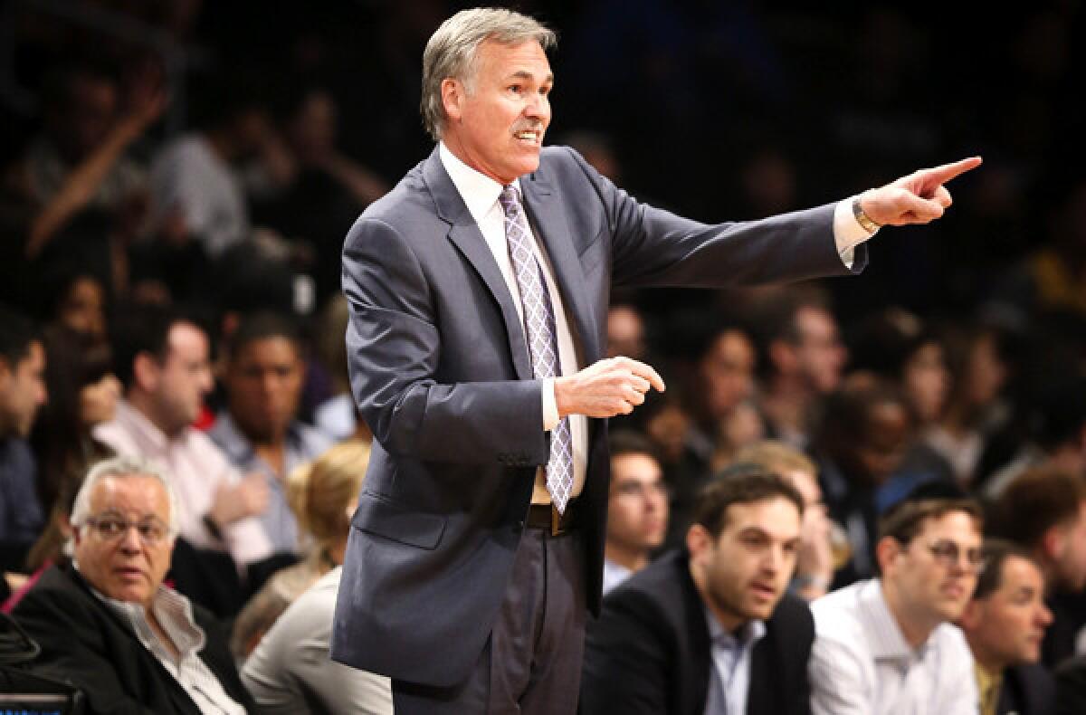 Lakers Coach Mike D'Antoni signals to his players in the first quarter of a game against the Brooklyn Nets last week in New York.
