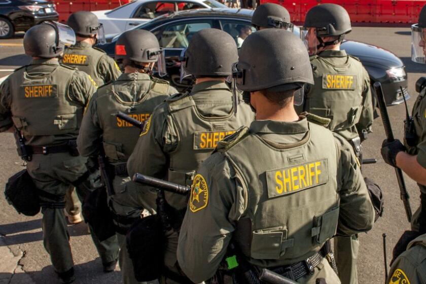 Orange County sheriff's deputies in riot gear in 2017.