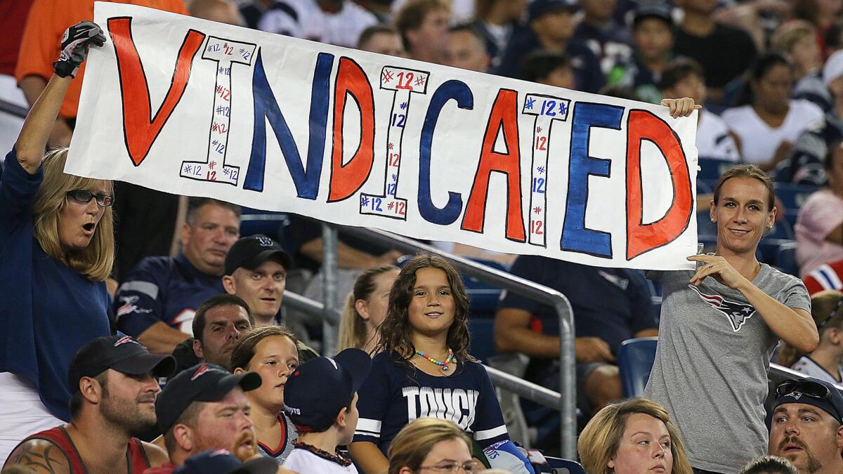 Fans show support for Patriots quarterback Tom Brady during a preseason game against the Giants on Sept. 3 after a judge lifted the four-game suspension levied against Brady in the Deflategate case.