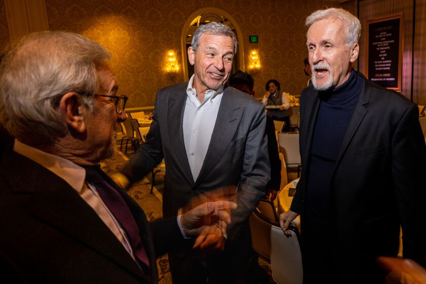 Los Angeles, CA - January 13: Director Seven Spielberg, left, Disney CEO Bob Iger and director James Cameron, right, at the AFI Awards at Four Seasons hotel, in Los Angeles, CA, Friday, Jan. 13, 2023. The entertainment industry's biggest names mingle, on the awards season's road toward the Oscars. (Jay L. Clendenin / Los Angeles Times)