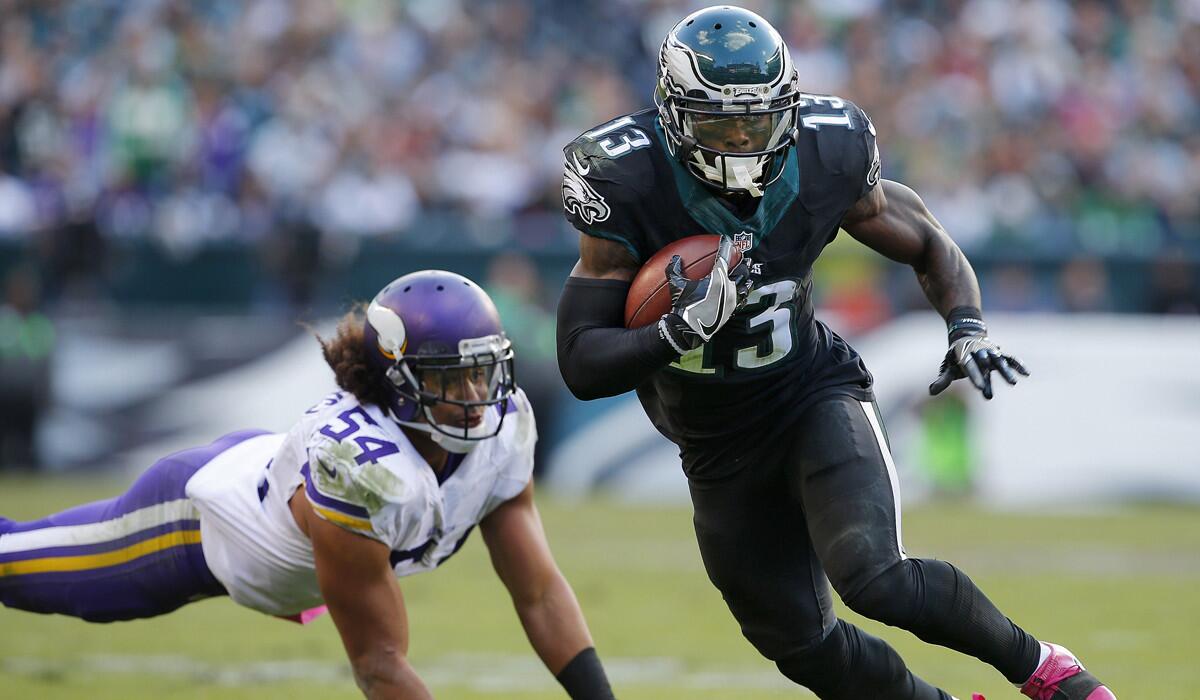 Philadelphia Eagles' Josh Huff (13) gets by Minnesota Vikings' Eric Kendricks after making a catch for a first down during the fourth quarter Sunday.