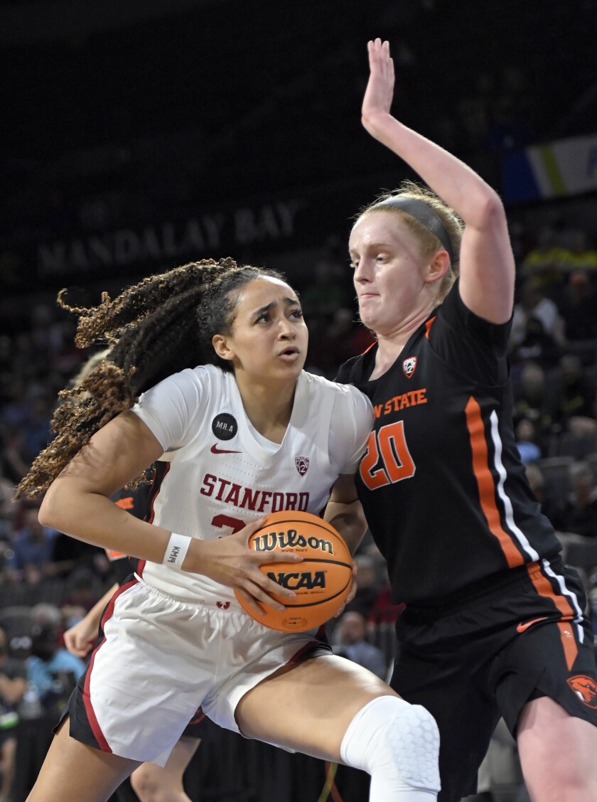 Stanford guard Haley Jones (30) drives with the ball as Oregon State forward Ellie Mack (20) defends during an NCAA college basketball game in the quarterfinals of the Pac-12 women's tournament Thursday, March 3, 2022, in Las Vegas. (AP Photo/David Becker)