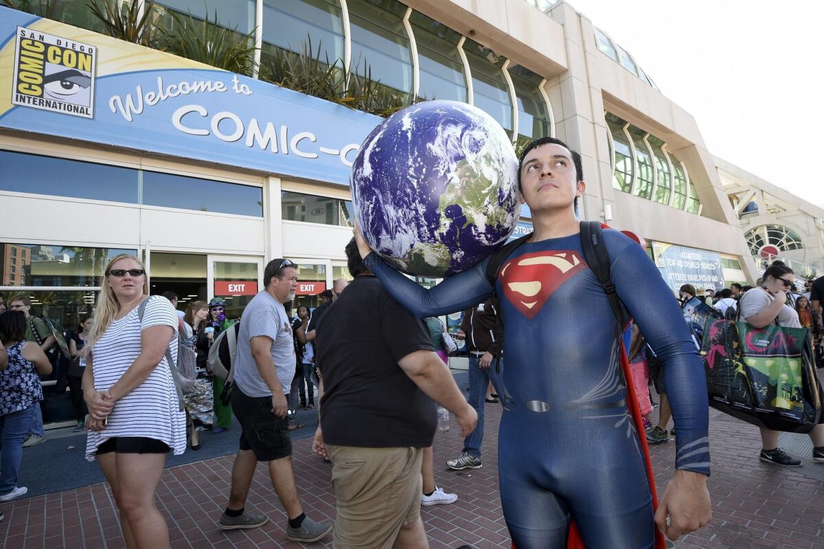 Bersain Gutierrez, dressed as Superman, poses in front of the convention center before Preview Night at Comic-Con International held at the San Diego Convention Center Wednesday July 20, 2016, in San Diego.