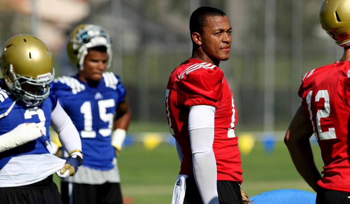 Quarterback Brett Hundley (no helmet) and his UCLA teammates will return to Cal State San Bernardino again this summer for training camp.