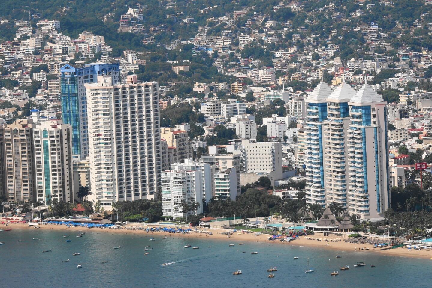 Gleaming beachside hotels and residences on Acapulco Bay -- seen from a distance -- suggest a sense of jet-set glamour. At night, the view is spectacular as ever.
