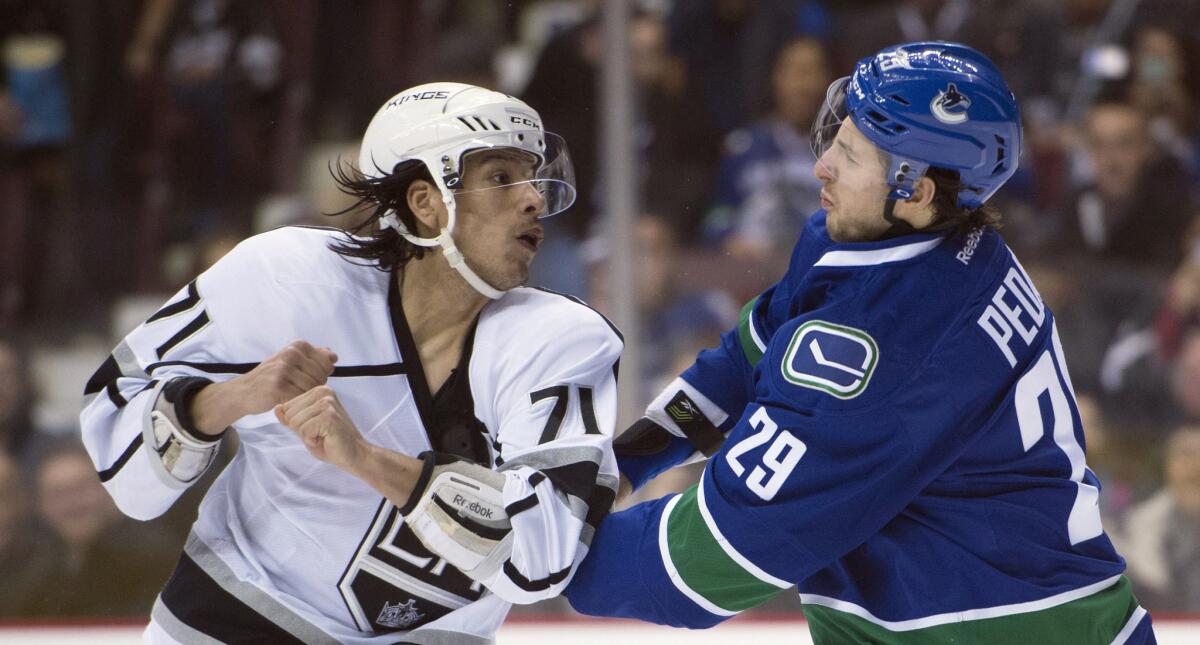 Kings center Jordan Nolan fights with Canucks defenseman Andrey Pedan during a Dec. 28 game in Vancouver, Canada.