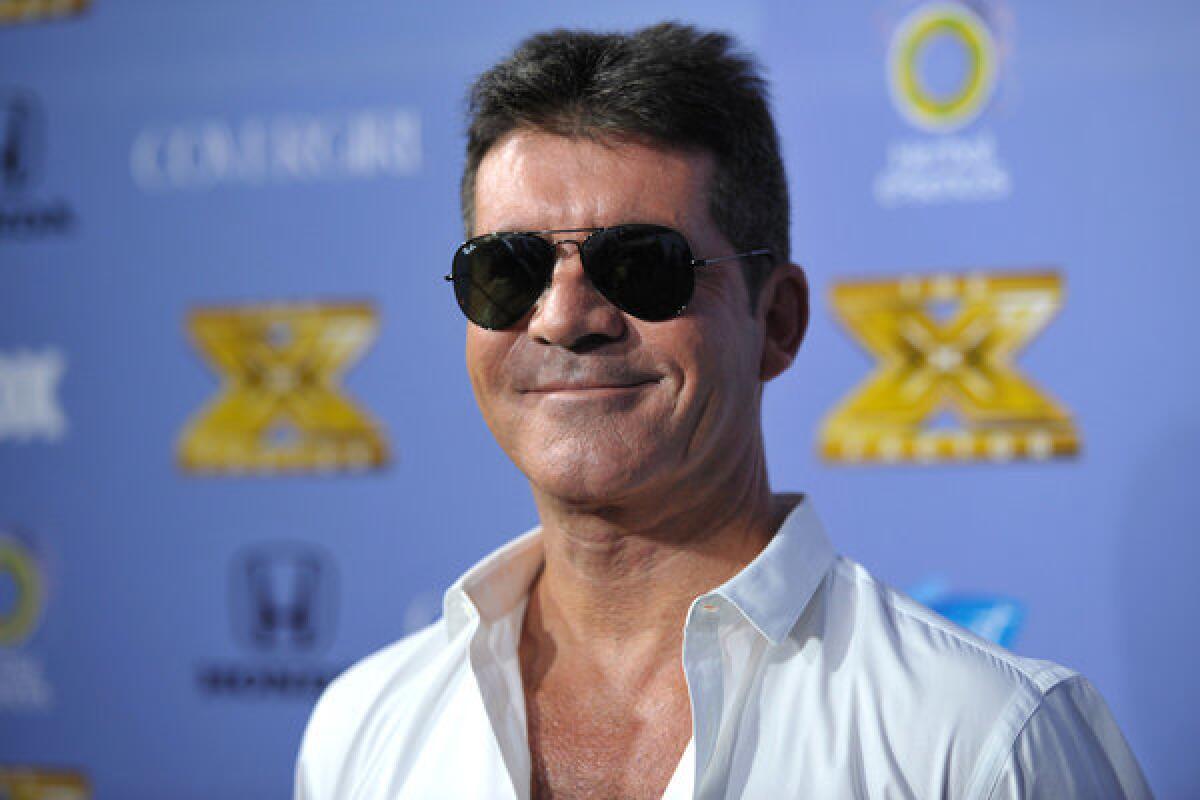 Producer and judge Simon Cowell arrives at "The X Factor" Season 3 premiere on Sept. 5.