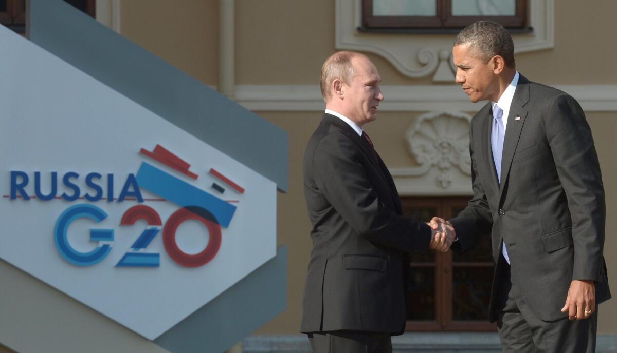 Russian President Vladimir Putin shakes hands with President Obama during a welcome ceremony for participants in a G20 summit in St. Petersburg on Sept. 5, 2013.