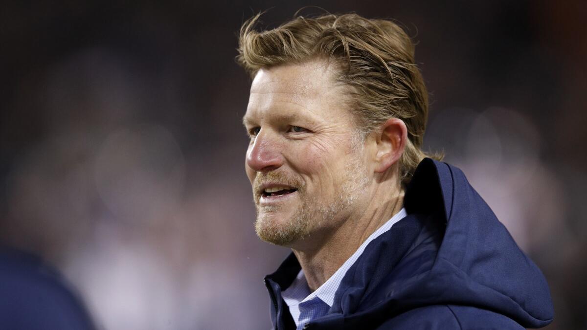 Rams general manager Les Snead watches warmups prior to a game against the Chicago Bears on Dec. 9.