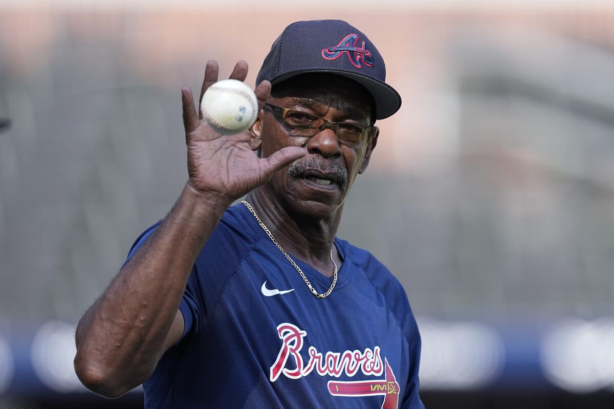  Ron Washington hits ground balls to his Atlanta Braves infielders on Aug. 21 in Atlanta.