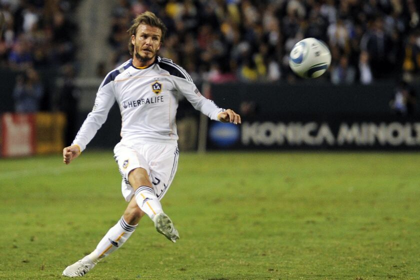FILE -Los Angeles Galaxy midfielder David Beckham kicks during the second half of their MLS Western Conference Final playoff match against FC Dallas, Sunday, Nov. 14, 2010, in Carson, Calif. Beckham was 31 and had just finished four seasons at Real Madrid when he joined the LA Galaxy in 2007. (AP Photo/Mark J. Terrill, File)
