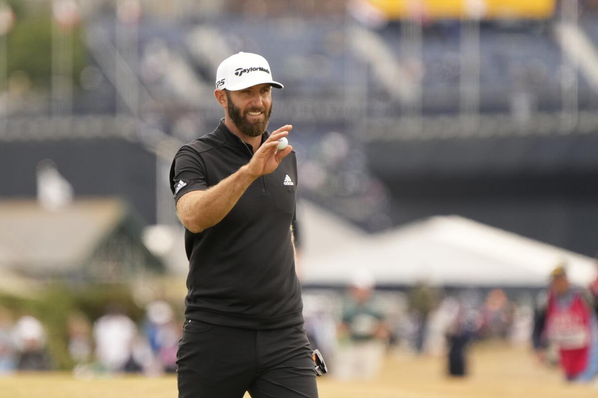 Dustin Johnson of the US after playing a birdie on the 16th hole during the second round of the British Open golf championship on the Old Course at St. Andrews, Scotland, Friday July 15, 2022. The Open Championship returns to the home of golf on July 14-17, 2022, to celebrate the 150th edition of the sport's oldest championship, which dates to 1860 and was first played at St. Andrews in 1873. (AP Photo/Gerald Herbert)