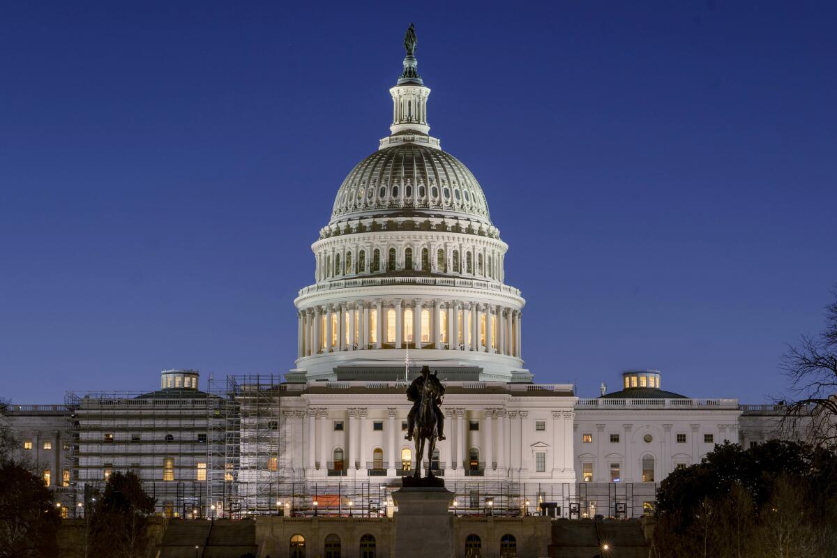 The U.S. Capitol building is seen before sunrise on Monday, March. 21, 2022. 