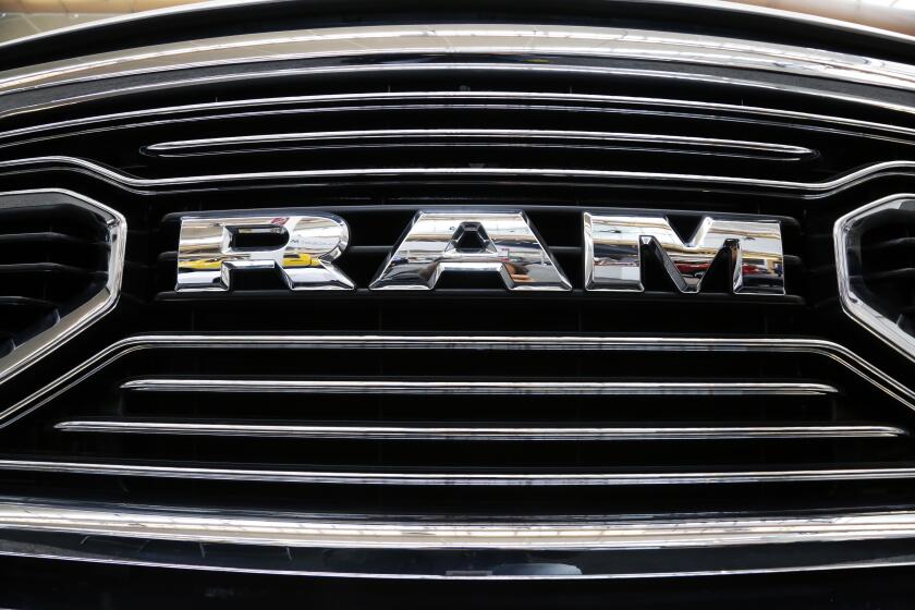 FILE - This grill of a Ram truck is on display at the Pittsburgh Auto Show, on Feb. 15, 2018. The Department of Justice released new details of a settlement with engine manufacturer Cummins Inc. Wednesday, Jan. 10, 2024, that includes a mandatory recall of 600,000 Ram trucks, and that the company remedy environmental damage it caused when it illegally installed emissions control software in several thousand vehicles, skirting emissions testing. (AP Photo/Gene J. Puskar, File)