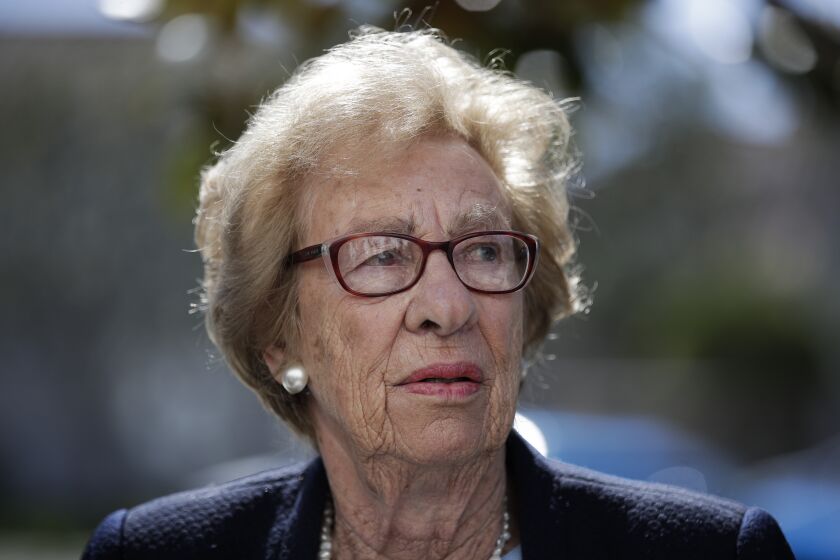 FILE - In this Thursday, March 7, 2019 file photo, Eva Schloss, the stepsister of Anne Frank and a Holocaust survivor, attends a news conference in Newport Beach, Calif. Holocaust survivors around the world are lending their voices to a campaign launched Wednesday July 29, 2020, targeting Facebook head Mark Zuckerberg, urging him to take action to remove denial of the Nazi genocide from the social media site. Eva Schloss is an Auschwitz survivor who today lives in London and has recorded a message for Zuckerberg. (AP Photo/Jae C. Hong, file)