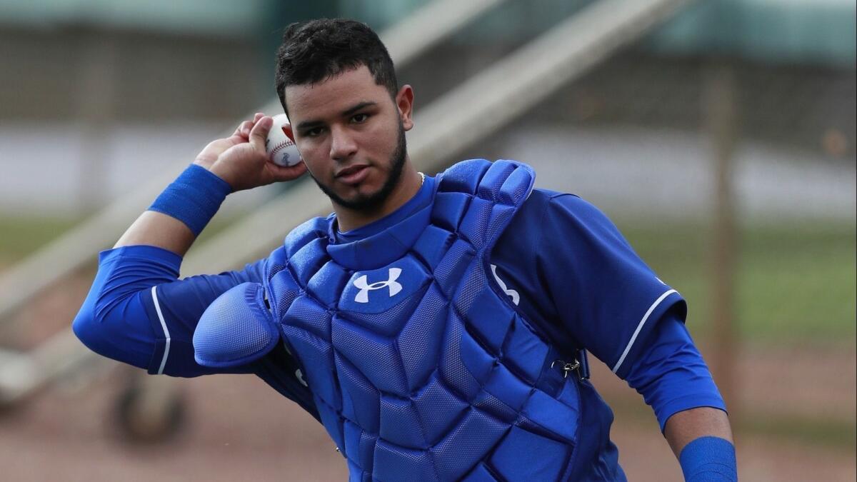 Dodgers catcher Keibert Ruiz participates in a drill at the team's spring training baseball facility in Phoenix on Monday.