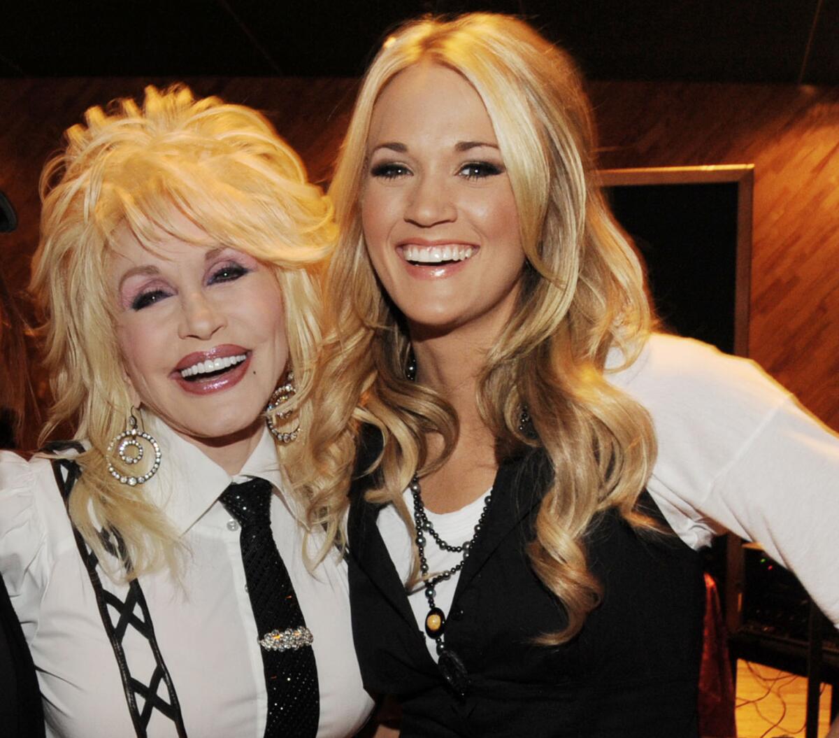 Dolly Parton, left, and Carrie Underwood in 2009.
