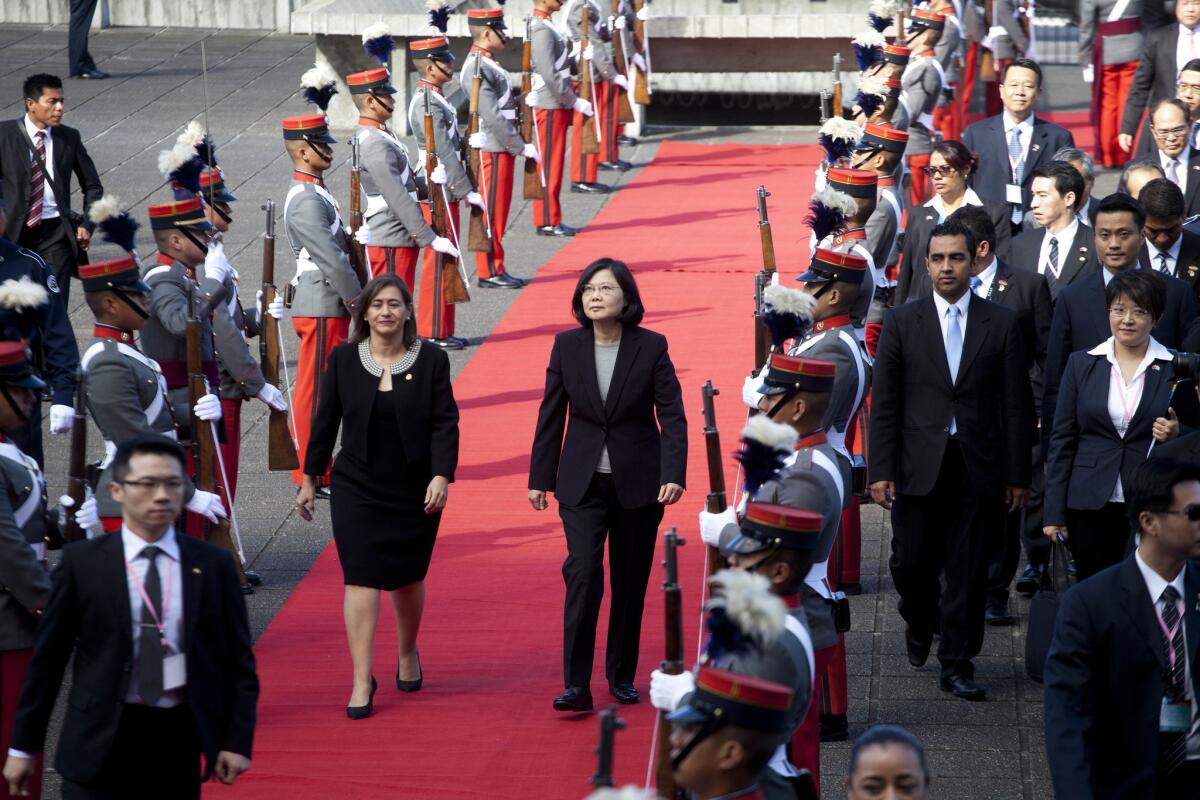 Taiwan's President Tsai Ing-wen, center right, arrives at the Supreme Court in Guatemala City, Guatamala, on Jan. 12, 2017 during a state visit.