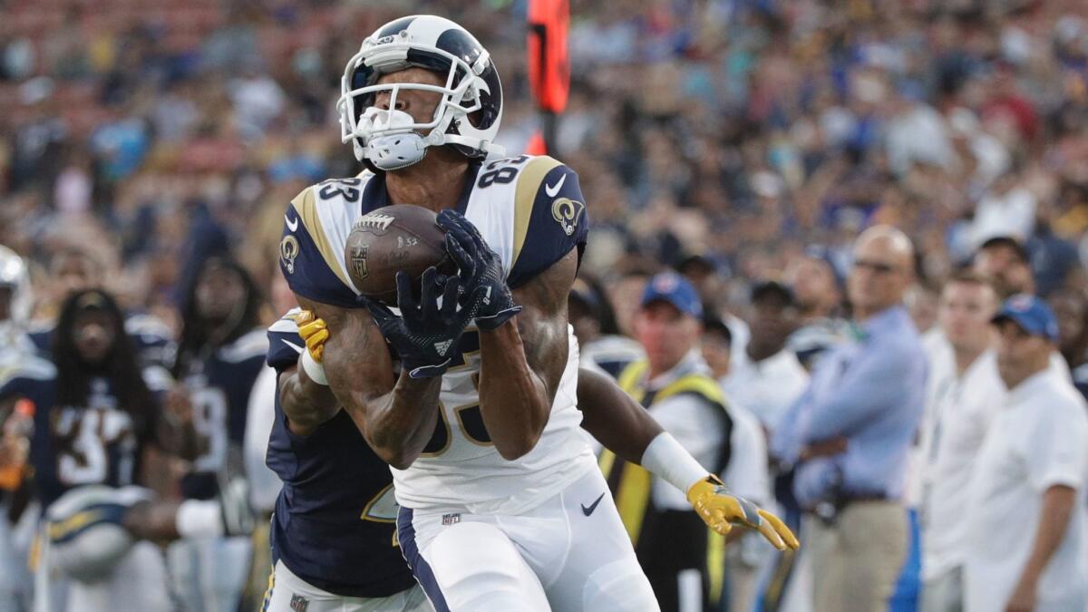 Rams receiver Josh Reynolds hauls in a touchdown pass against cornerback Randall Evans on Aug. 26.