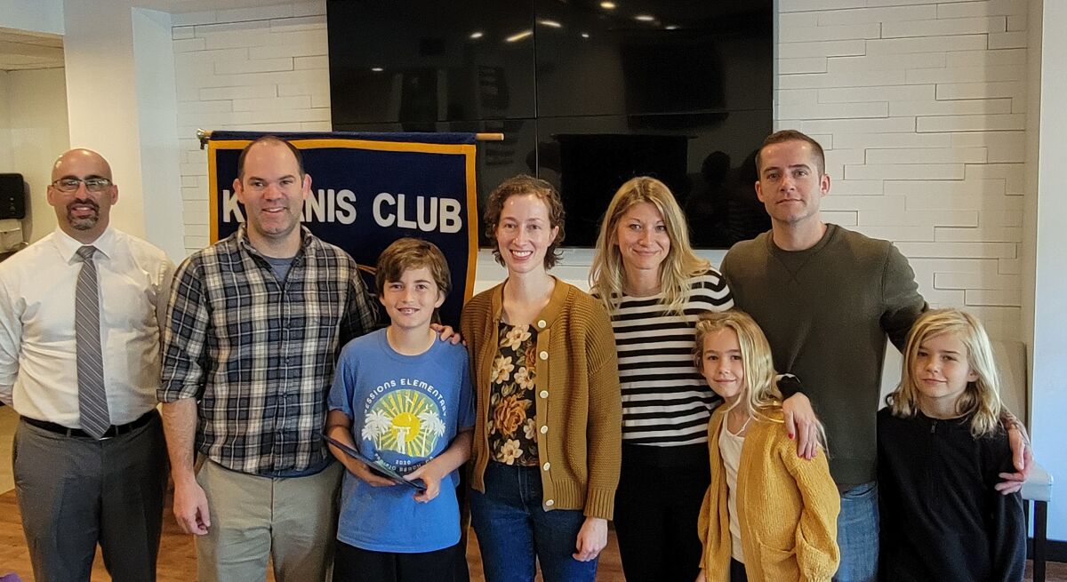 PB Kiwanis President Tony Bayona with Dan, Henry and Meredith Riley; and Kelly, Lillian, Zach and Dylan Gill.