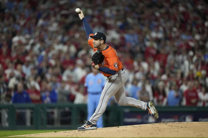 Houston Astros starting pitcher Justin Verlander throws against the Philadelphia Phillies during the first inning in Game 5 of baseball's World Series between the Houston Astros and the Philadelphia Phillies on Thursday, Nov. 3, 2022, in Philadelphia. (AP Photo/David J. Phillip)