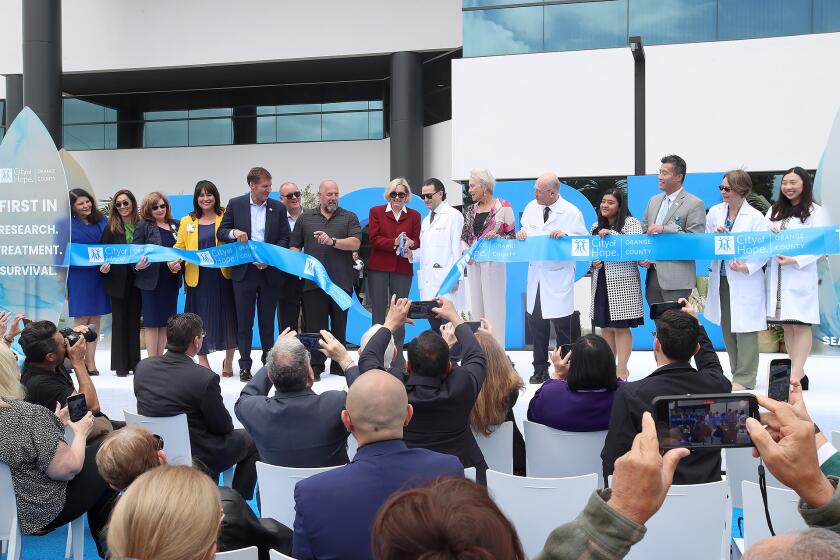 Patients, staff, public officials, physicians, and administrators gather in front of the new City of Hope, Seacliff location for ribbon-cutting and grand opening ceremony in Huntington Beach on Tuesday morning.