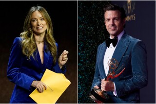 A split image of a woman holding an envelope, left, and a man holding an Emmy