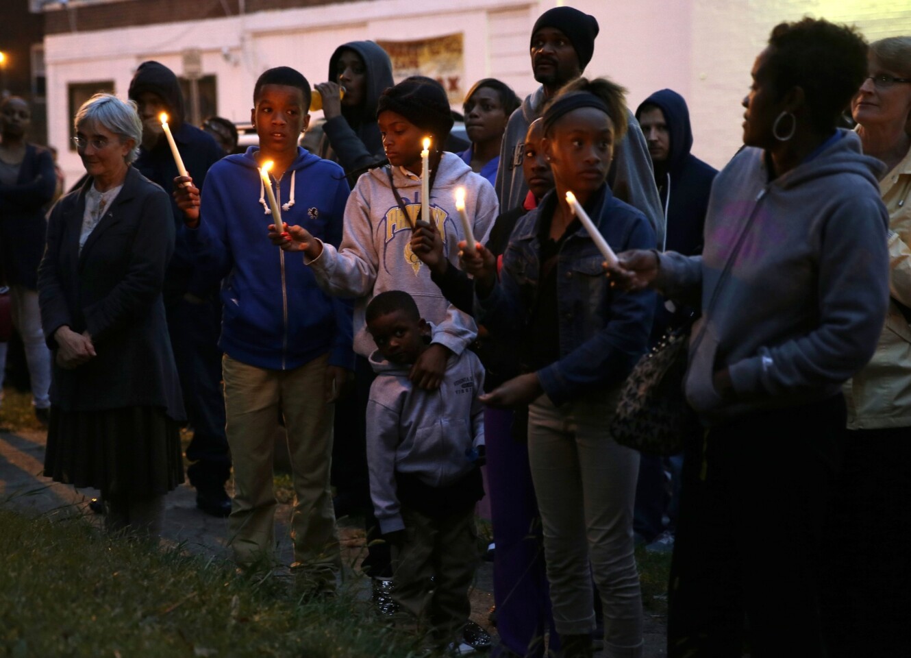 People gather to remember Vonderrit D. Myers, 18, fatally shot by a police officer in St. Louis on Wednesday.