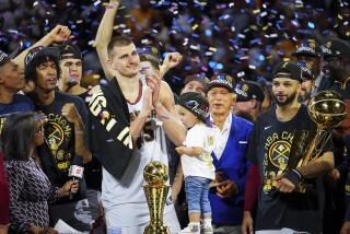 Denver Nuggets center Nikola Jokic, center left, celebrates with teammates after the team won the NBA Championship with a victory over the Miami Heat in Game 5 of basketball's NBA Finals, Monday, June 12, 2023, in Denver. (AP Photo/Jack Dempsey)