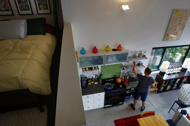 Christopher Salem, 49, owned a nearby condominium that he bought with a zero down loan and currently has up for a short sale. He now lives in a 400-square-foot loft with his partner and their three dogs.