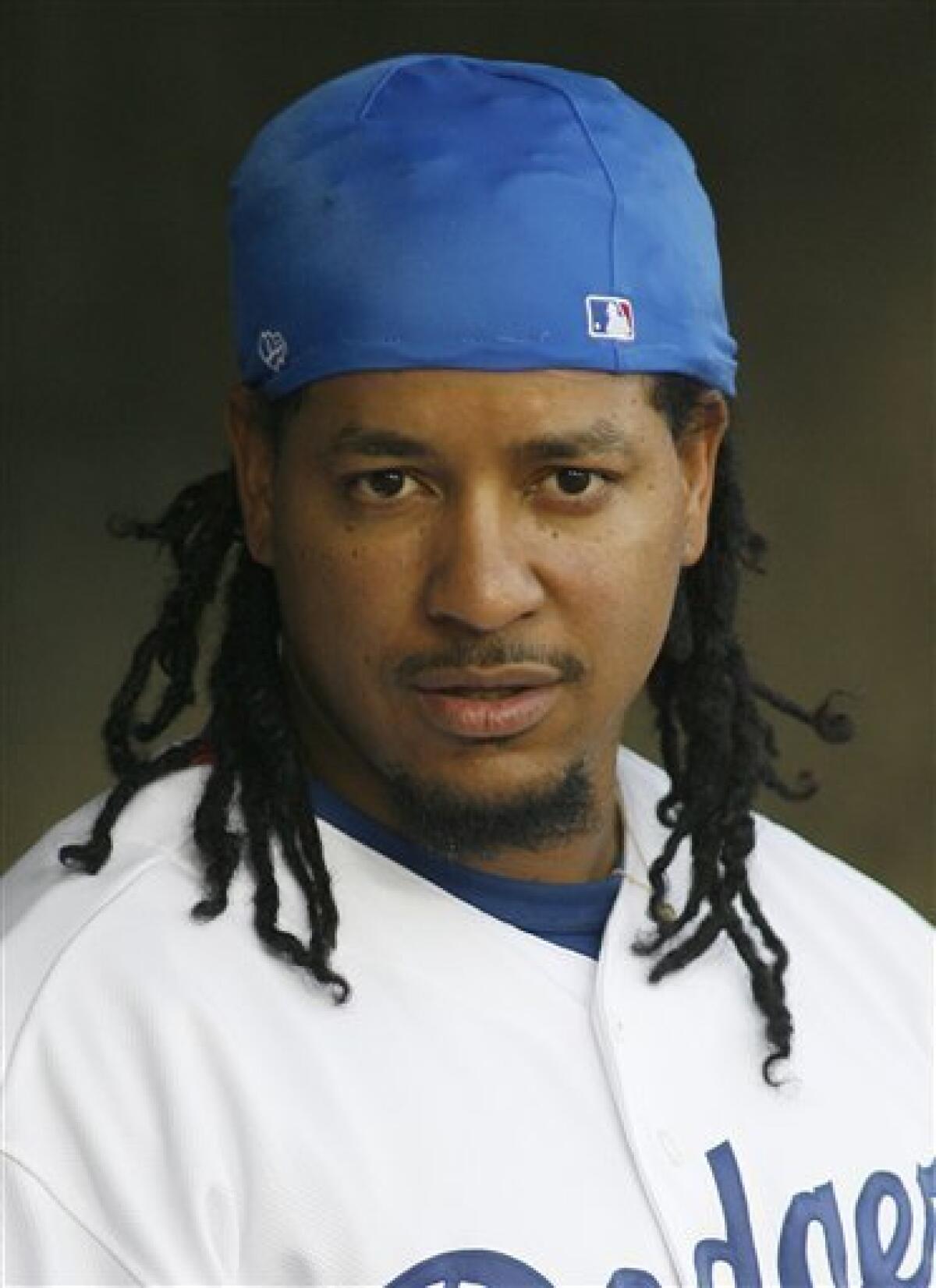 Boston Red Sox Manny Ramirez, with his hair in dread locks, is shown during  batting practice before his team's spring training baseball game against  the Baltimore Orioles in Ft. Lauderdale, Fla., Wednesday