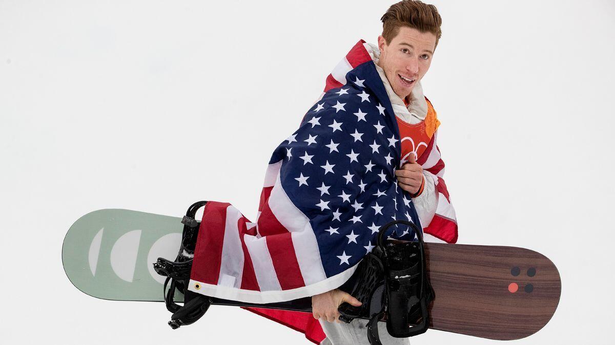 Shaun White celebrates after winning the gold medal in the men's half pipe snowboard finals at Phoenix Park in South Korea on Wednesday during the Pyeongchang Winter Olympics.
