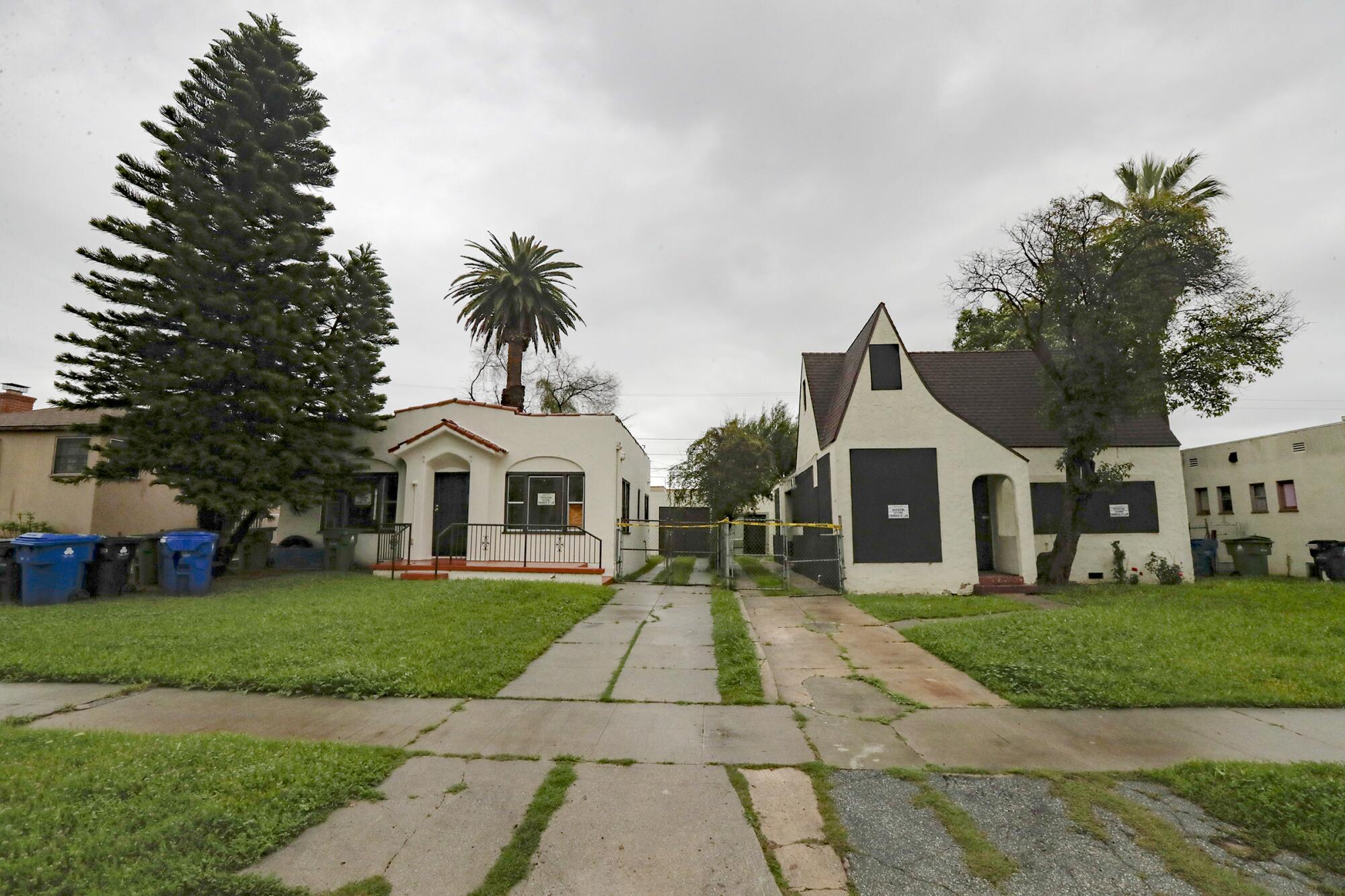 A view of the front of two houses from the street in El Sereno.
