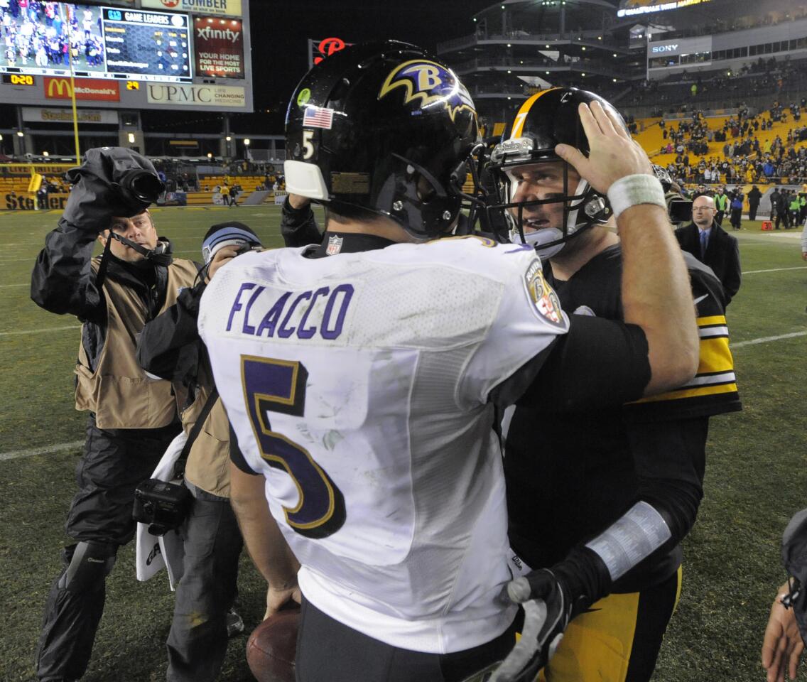 Ravens quarterback Joe Flacco and Steelers quarterback Ben Rothlisberger greet one another after the Ravens 30-17 victory.