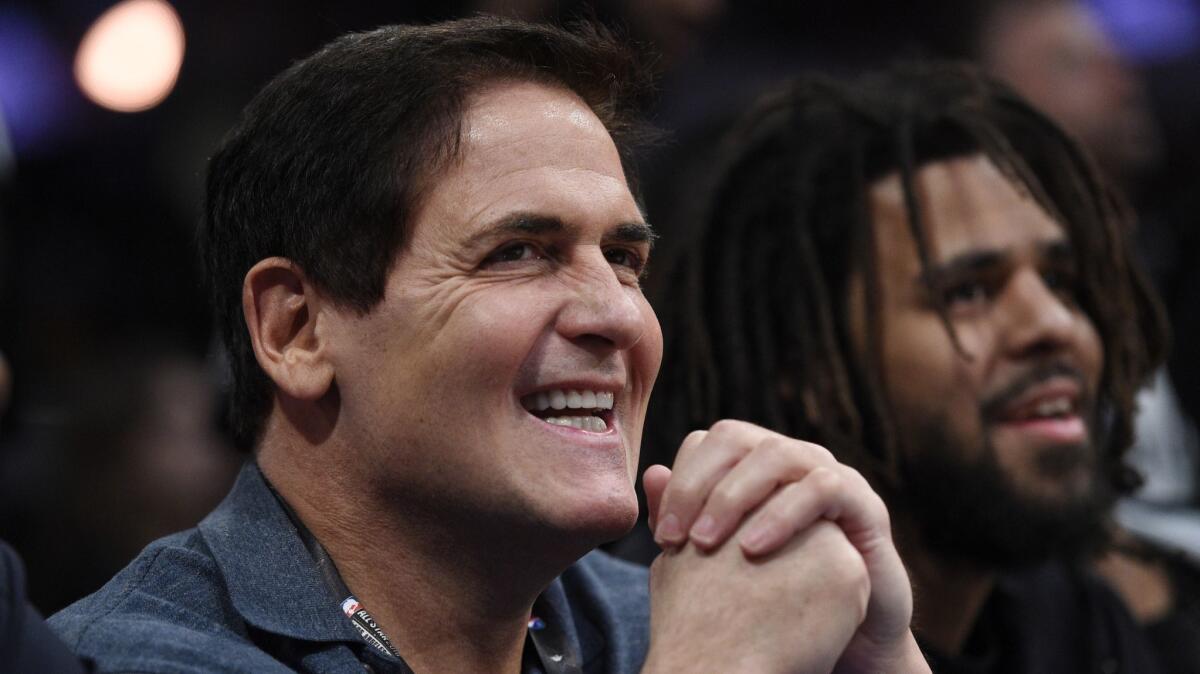 Dallas Mavericks owner Mark Cuban looks on from the crowd during NBA All-Star Saturday in Los Angeles on Feb. 17.