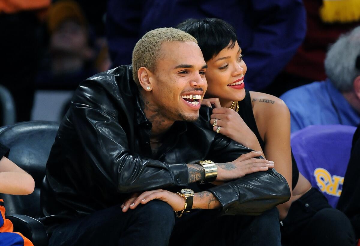 Chris Brown and Rihanna together at a Lakers game in December.
