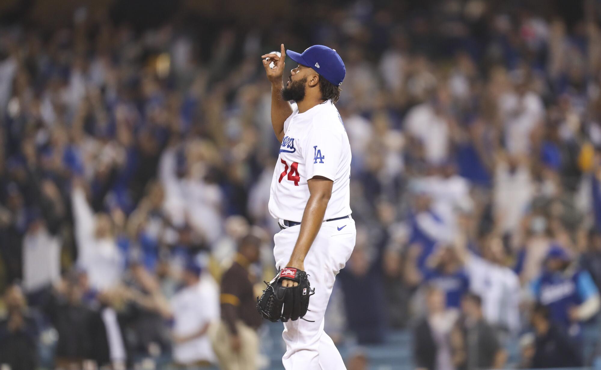 Dodgers closer pitcher Kenley Jansen points a finger in the air after getting the final out against the San Diego Padres.