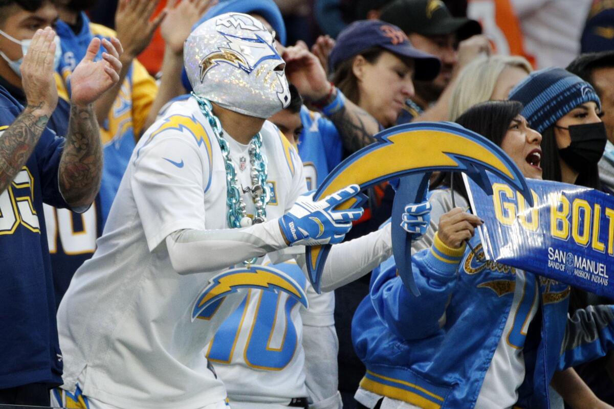 A Charger fan dresses in all white, like a bolt of lightning