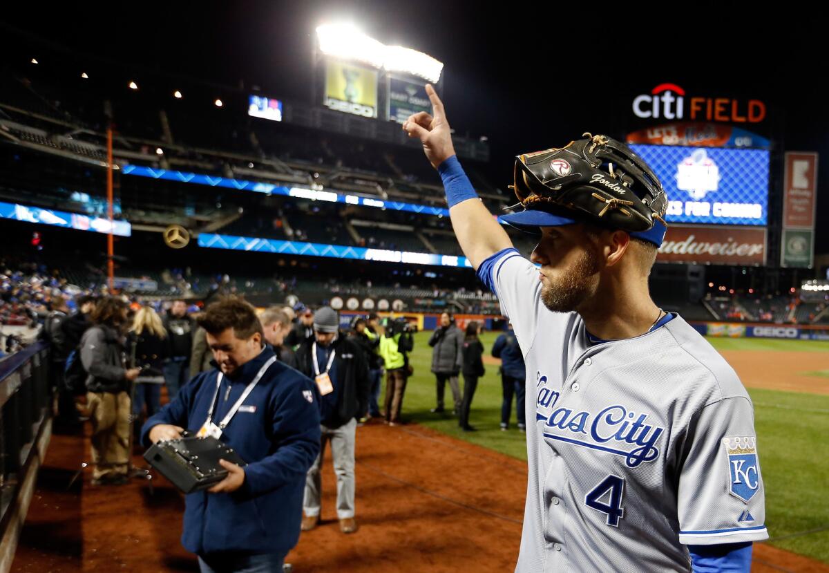 Kansas City outfielder Alex Gordon celebrates after winning a World Series game against the Mets. Could Gordon fill the Angels outfield needs?