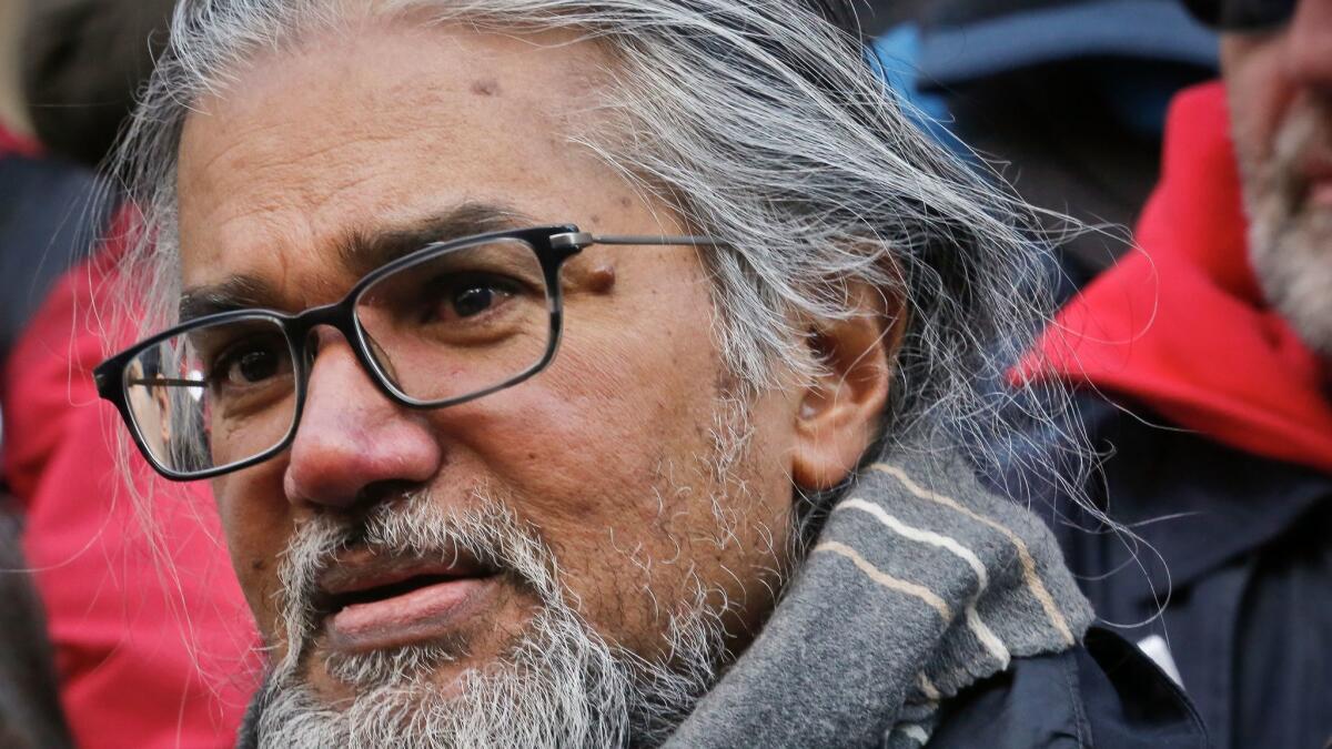 Ravi Ragbir, a citizen of Trinidad and Tobago who leads the New Sanctuary Coalition of New York City, listens during a news conference called by city council members on his behalf as he fights deportation on Jan. 31, 2018, at New York City Hall.