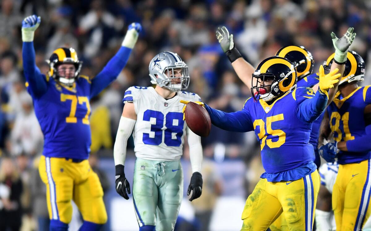 Running back C.J. Anderson (35) celebrates ;after gaining a first down that allowed the Rams to run out the clock in the fourth quarter.