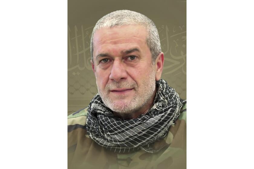 This picture released by Hezbollah media relations office, shows a portrait of Hezbollah commander Mohammad Naameh Nasser, who was killed by an Israeli airstrike that hit his car, in the southern costal town of Tyre, Lebanon, Wednesday, July 3, 2024. The strike took place as global diplomatic efforts have intensified in recent weeks to prevent escalating clashes between Hezbollah and the Israeli military from spiralling into an all-out war that could possibly lead to a direct confrontation between Israel and Iran. (Hezbollah Media Relations Office via AP)