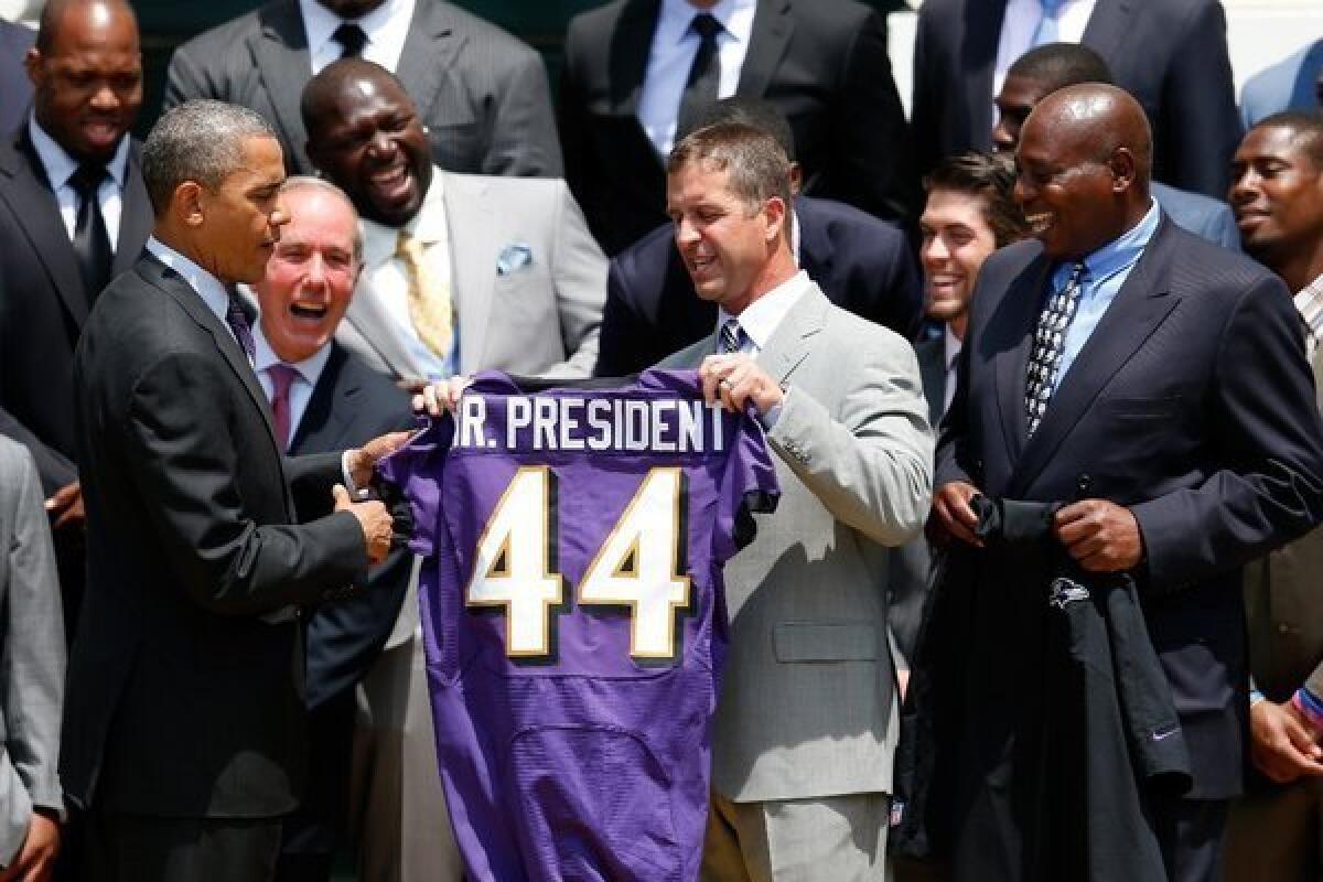 President Obama welcomed the Super Bowl champion Baltimore Ravens football team at the White House last month. But the NFL doesn't appear interested in the federal healthcare law.