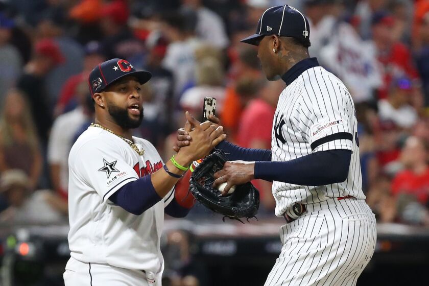 CLEVELAND, OHIO - JULY 09: Carlos Santana #41 of the Cleveland Indians and the American League celebrates with Aroldis Chapman #54 of the New York Yankees and the American League after defeating the National League All-Stars 4-3 in the 2019 MLB All-Star Game, presented by Mastercard at Progressive Field on July 09, 2019 in Cleveland, Ohio. (Photo by Gregory Shamus/Getty Images) ** OUTS - ELSENT, FPG, CM - OUTS * NM, PH, VA if sourced by CT, LA or MoD **