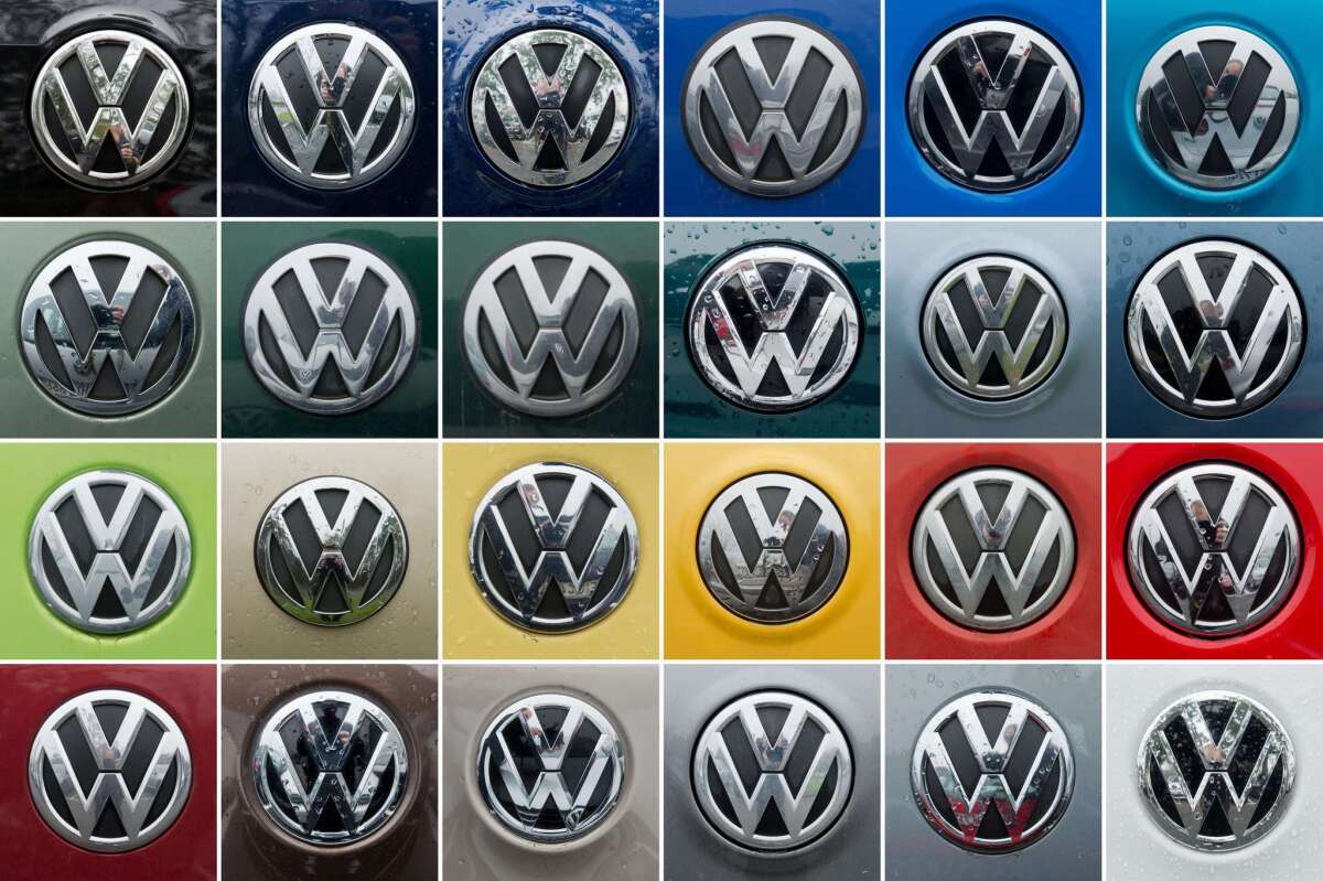 Logos of German car maker Volkswagen are seen on various cars in a parking site of the VW plant in Wolfsburg, central Germany.