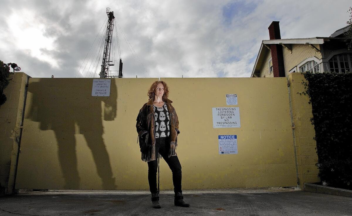 DonnaAnn Ward, founder of the grass-roots group Cowatching Oil L.A., wants the city to ban "well stimulation" practices from being used at drilling sites like this one at Jefferson Boulevard and Budlong Avenue.